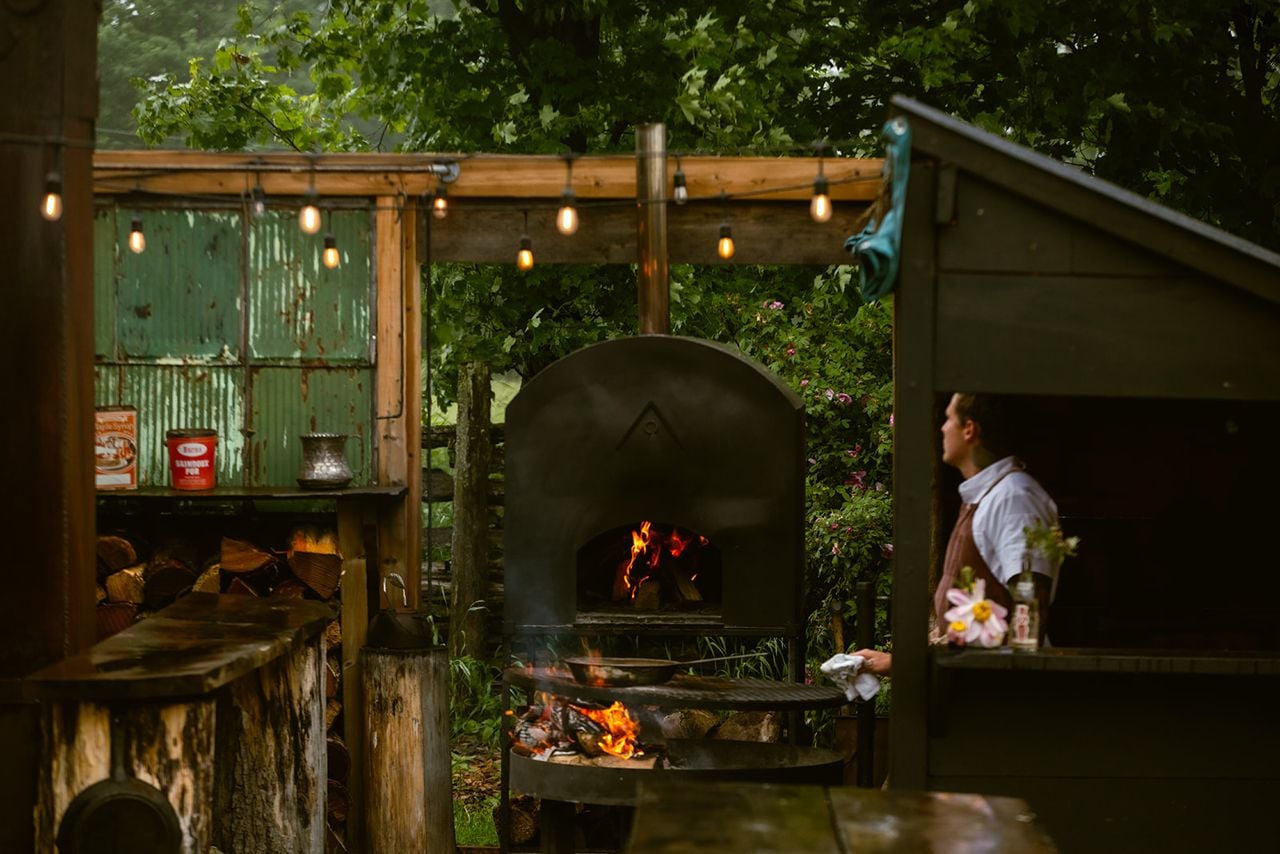 The outdoor kitchen and wood stove at Down Home