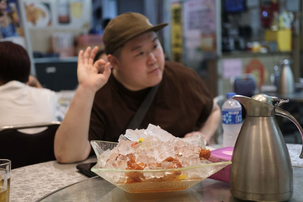 Chef Eva Chin with an order of sweet-and-sour pork on ice at Go Go Restaurant in Hong Kong