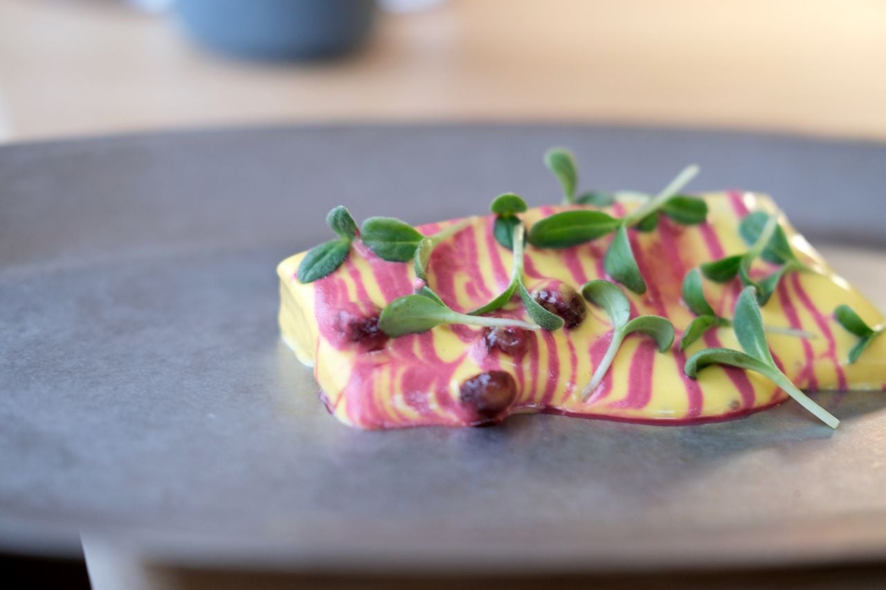 Dry aged B.C. Arctic char topped with butter béarnaise, beetroot vinaigrette, house-made beetroot "capers" and fresh borage.