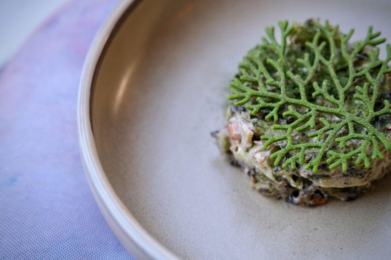 Charred broccoli tossed in an aged cheddar dressing, with trout bacon and black walnuts