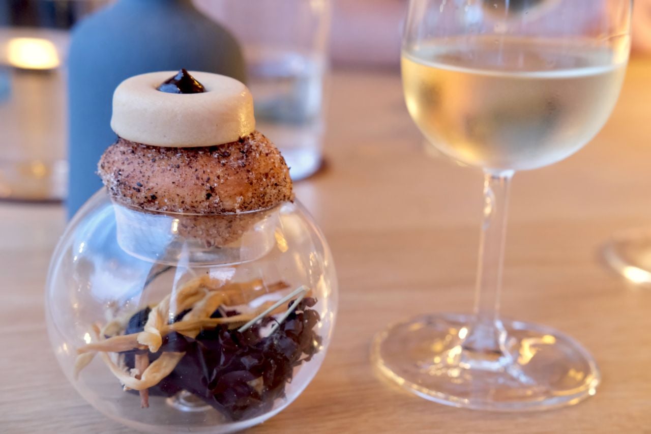 A sugar-dusted profiterole, topped foie gras ice cream and sun-dried Niagara cherry marmalade
