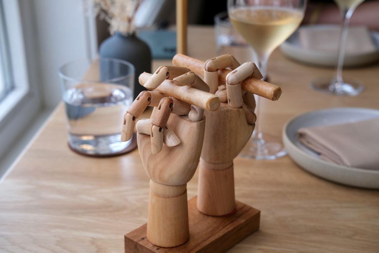 These French onion cigarettes pair caramelized onion, parsnip and cheddar cream inside a brown butter-maple brick dough