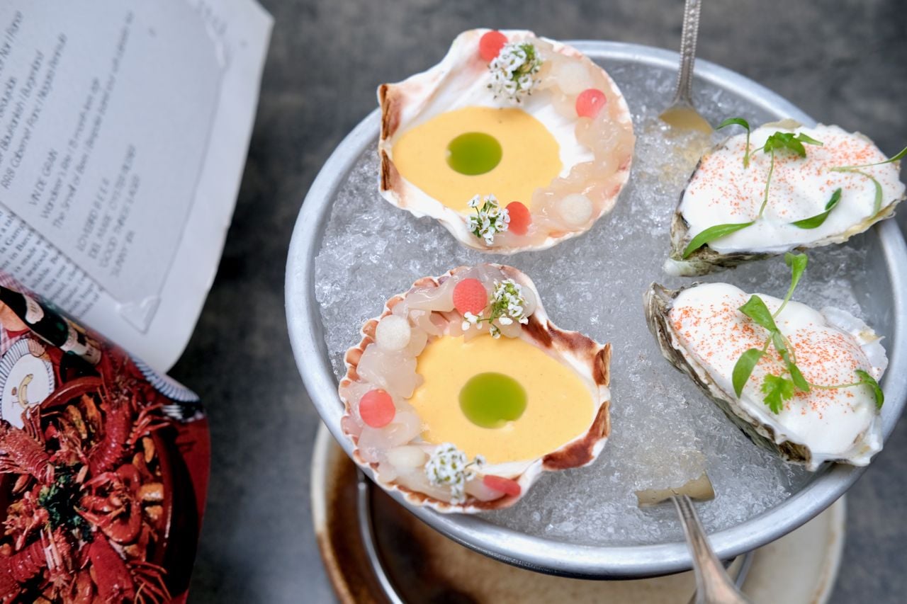 Each guest gets a Sun Seeker oyster from Fanny Bay, BC, topped dashi foam and with Big Mac-inspired sauce the kitchen’s dubbed “Mac-onette,” and a scallop ceviche on the half shell