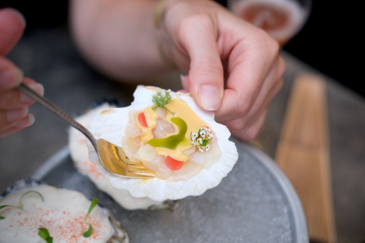 Here’s a closer look at the Digby scallop ceviche dressed with sea buckthorn, chive oil, pickled radish and alyssum flowers