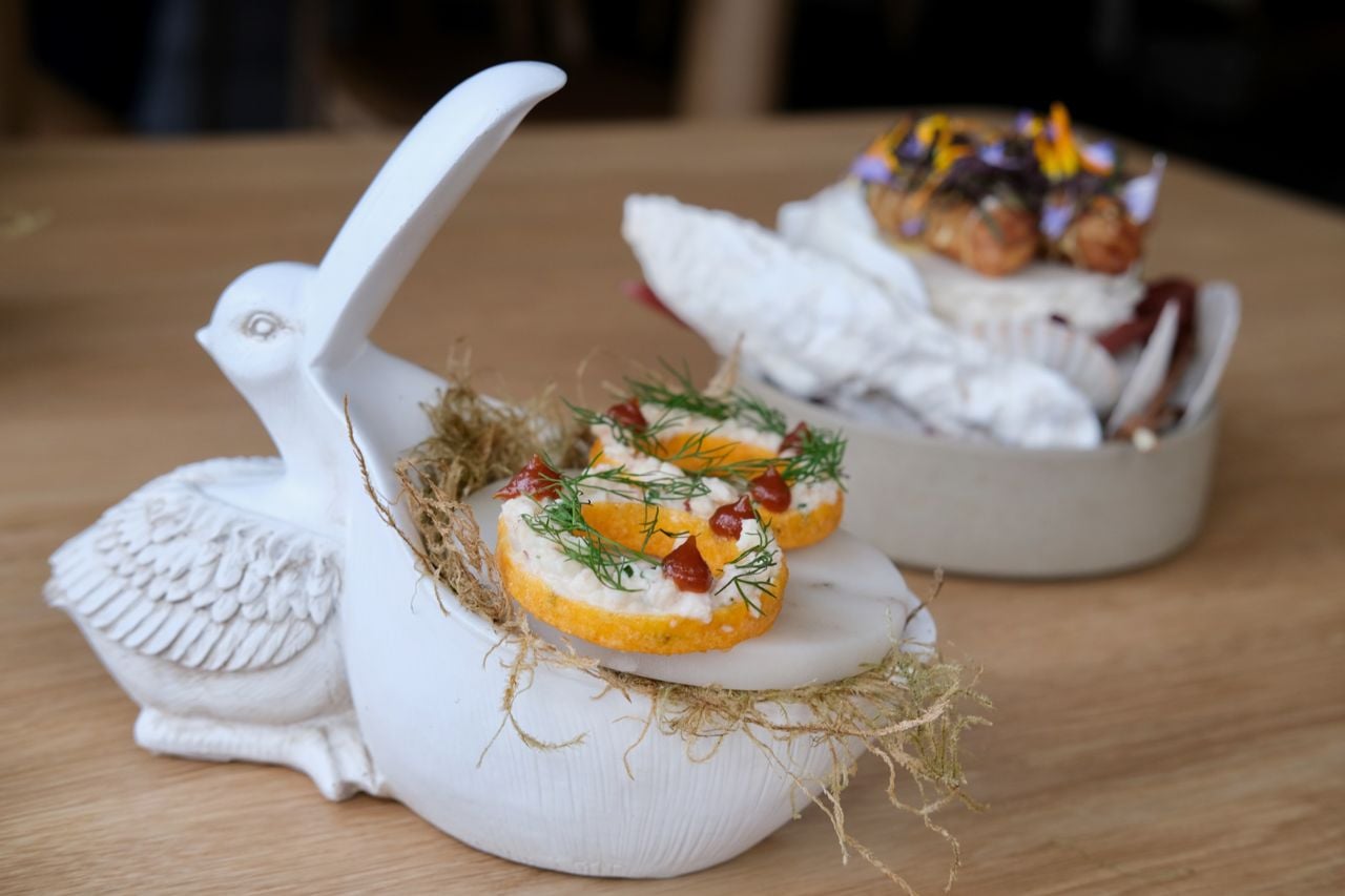 A reimagined shrimp ring at Lore Restaurant, served on a pelican-shaped plate