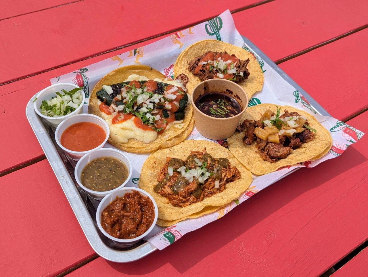 An order of tacos and dipping sauces from the Mustang Drive-In in PEC