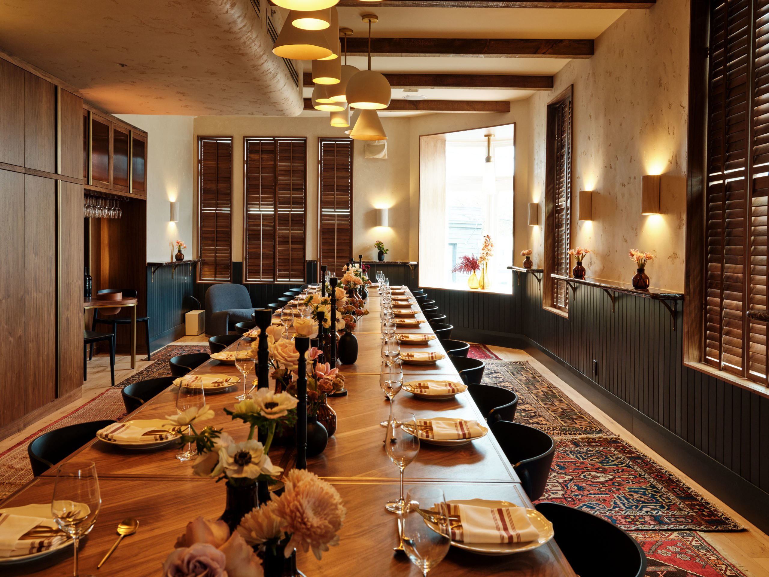 Trapezi by Mamakas private dining room in Toronto set for a shared meal