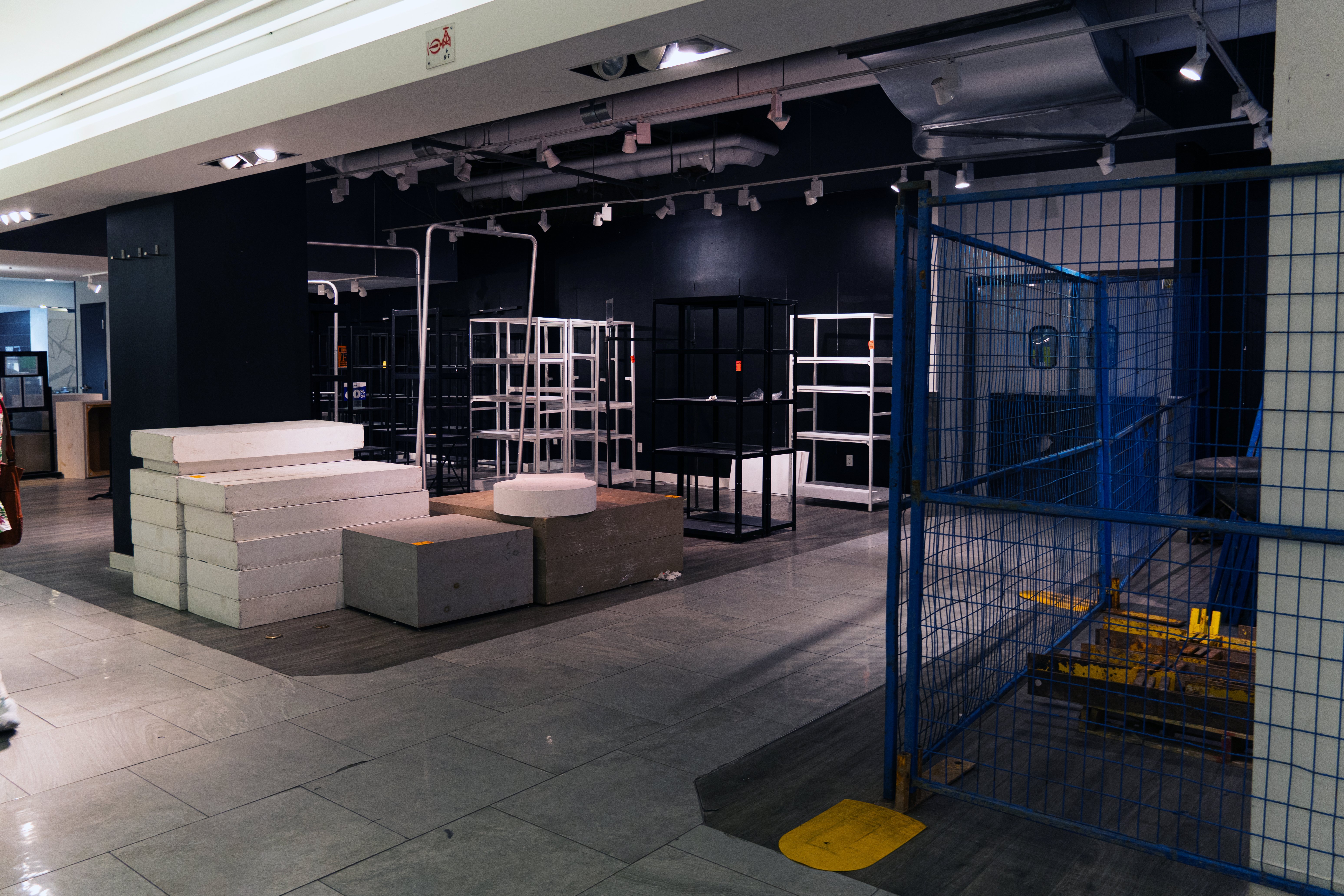 Displays and merchandise sit packed up in boxes on the floor. 