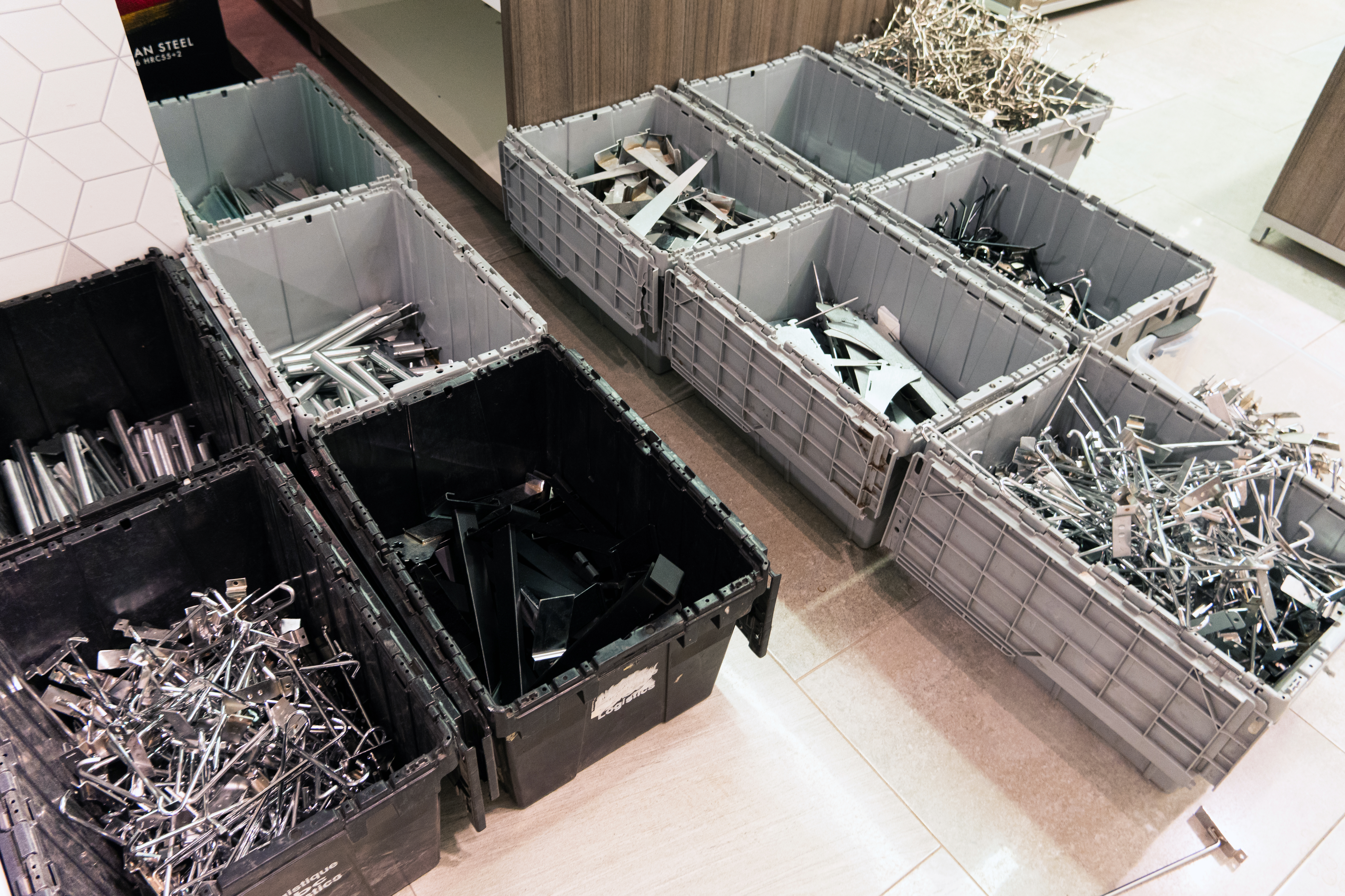 Hangers and other fixtures lay in storage boxes. 