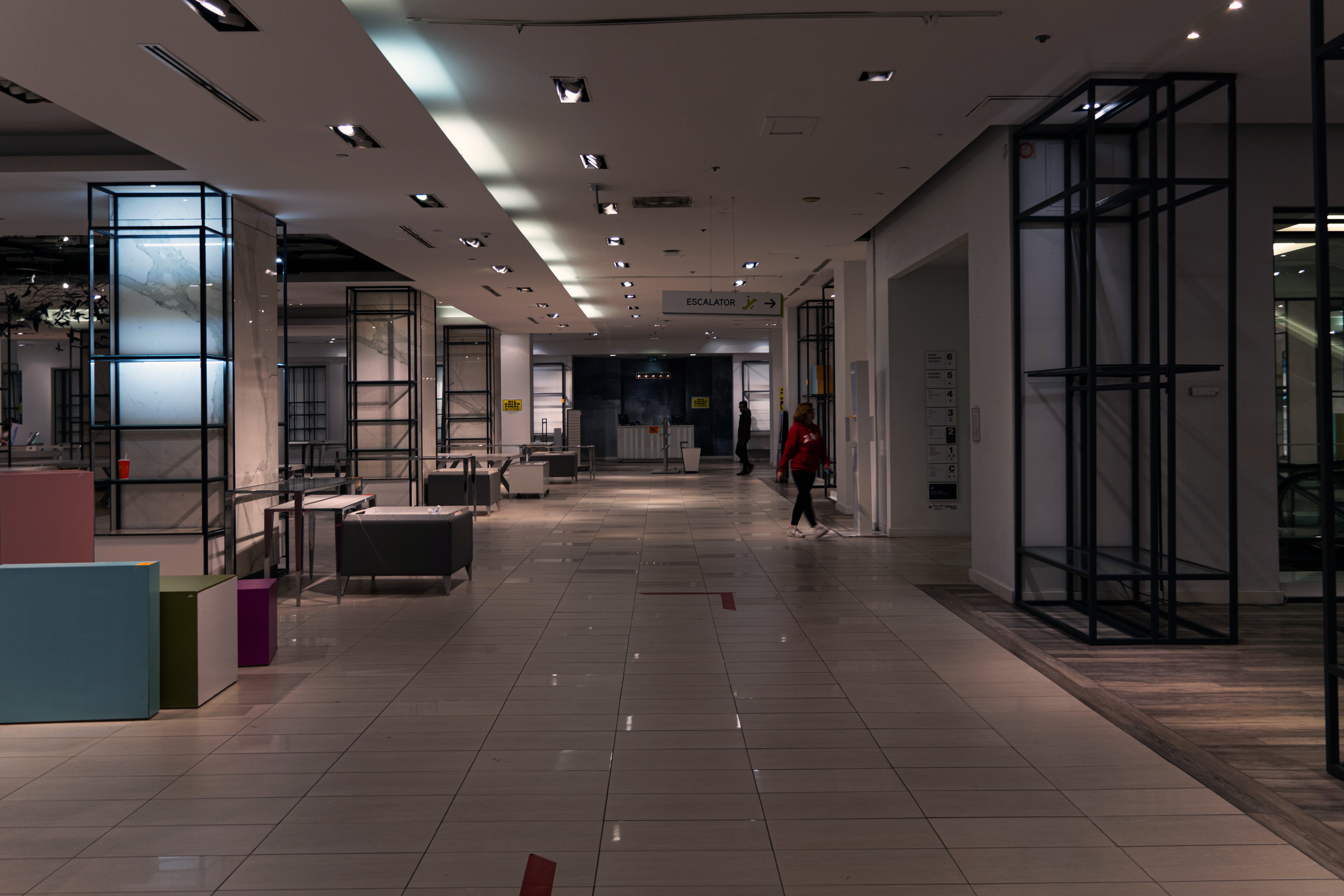 A concourse in the Bay's Yonge and Queen store, lined with empty shelves. 