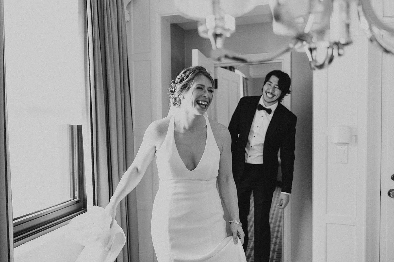 A black and white photo of Caroline and Mauricio at their wedding at Canoe