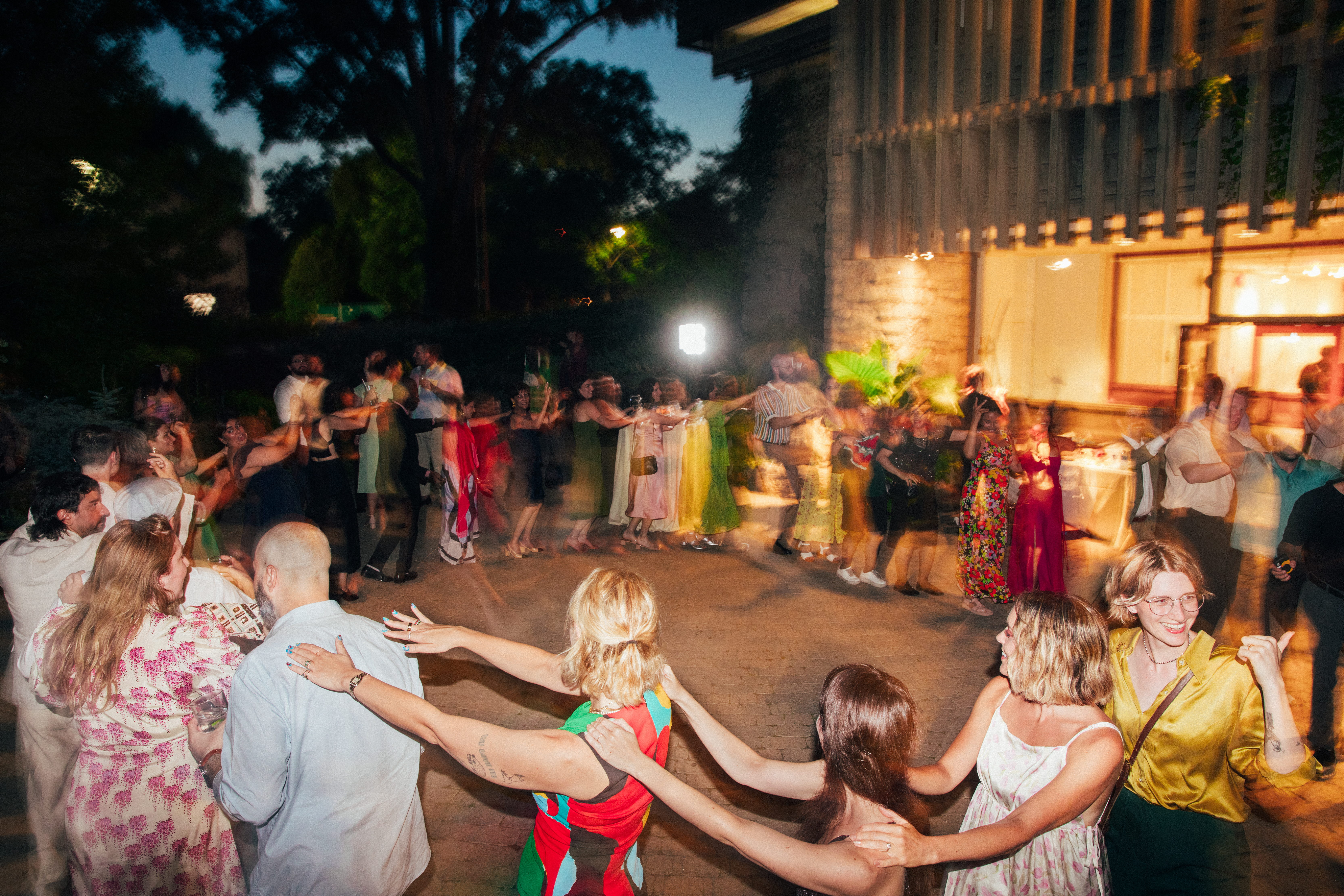 Guests dancing at Melina and Zach's wedding