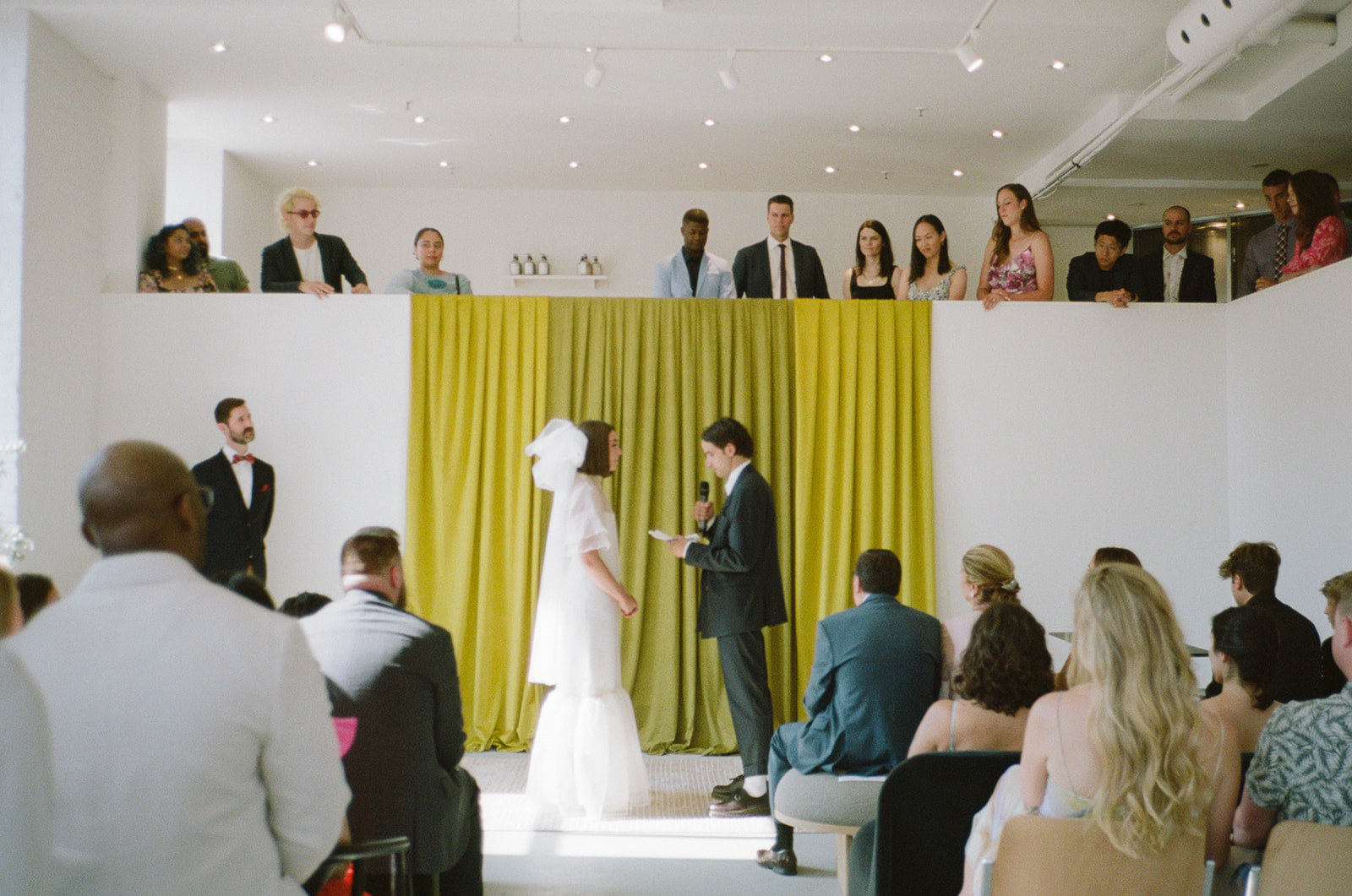 Brjánn reads his vows to Ryanne on the altar.