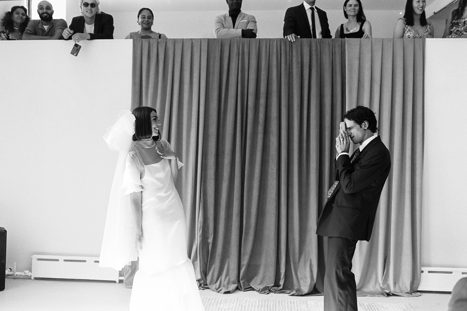 Brjánn takes a picture of Ryanne on the altar as she poses.