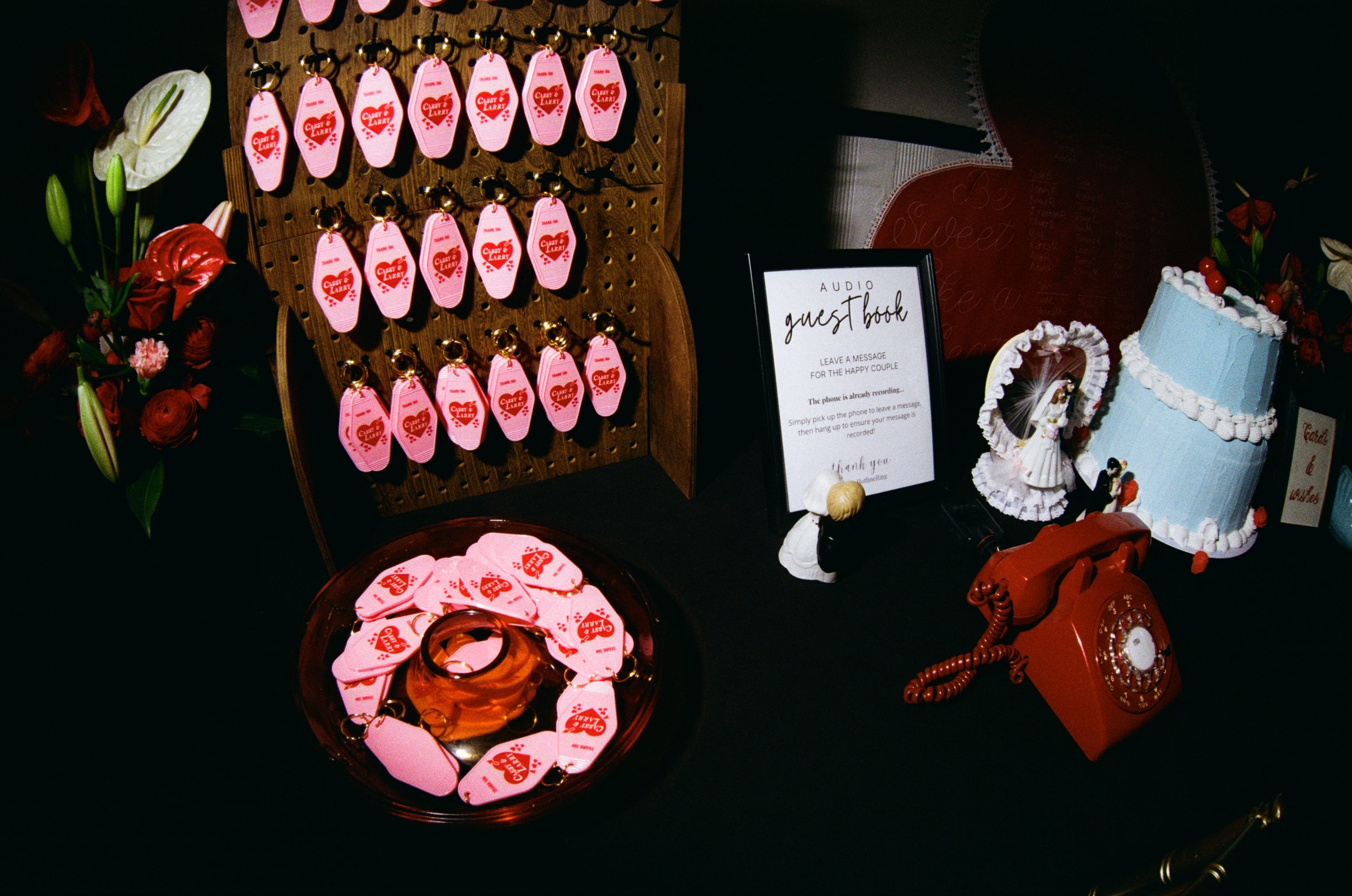A board of hotel keys branded for Cassy and Larry's wedding