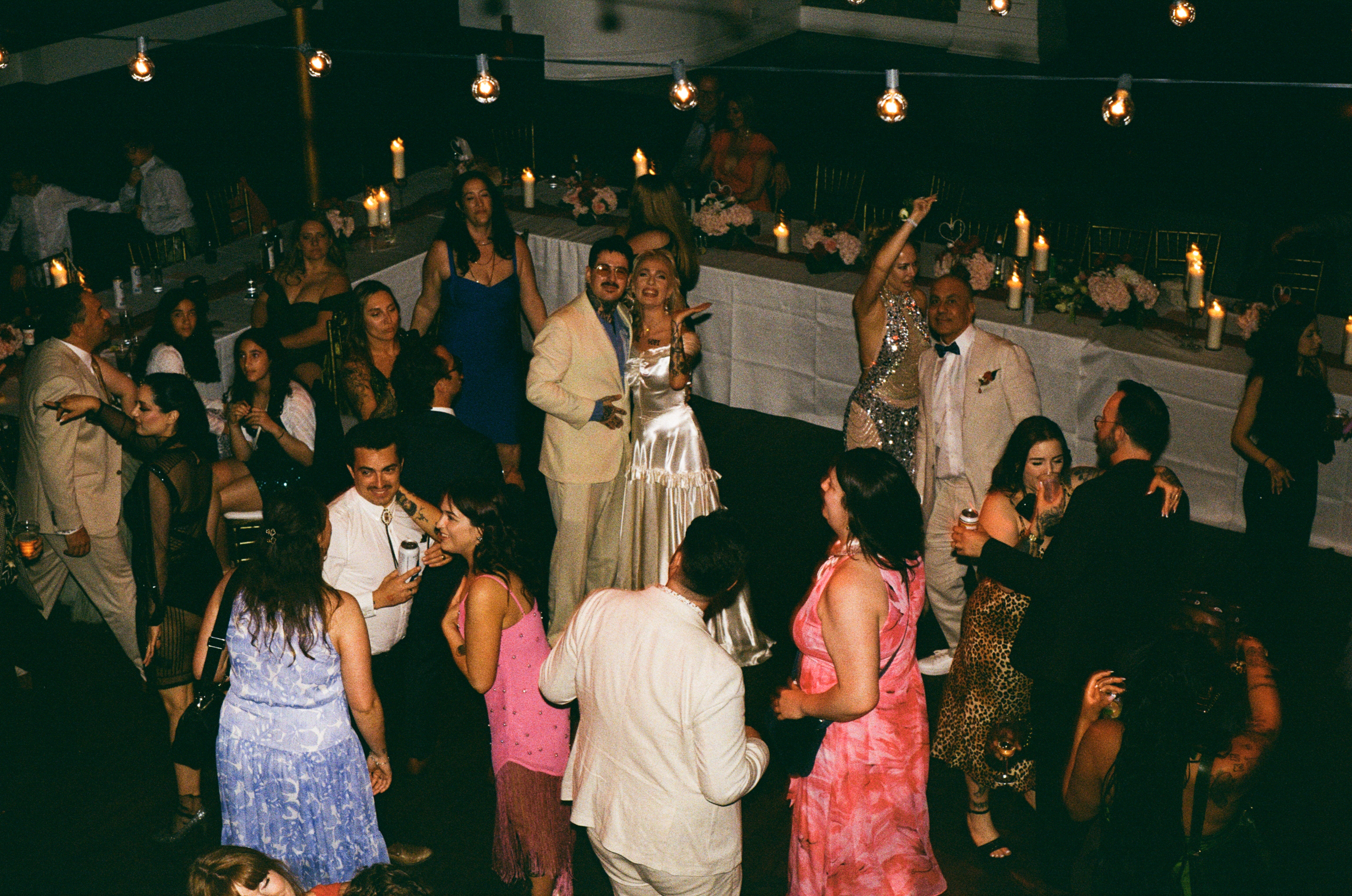 An overhead shot of guests mingling at Cassy and Larry's wedding reception