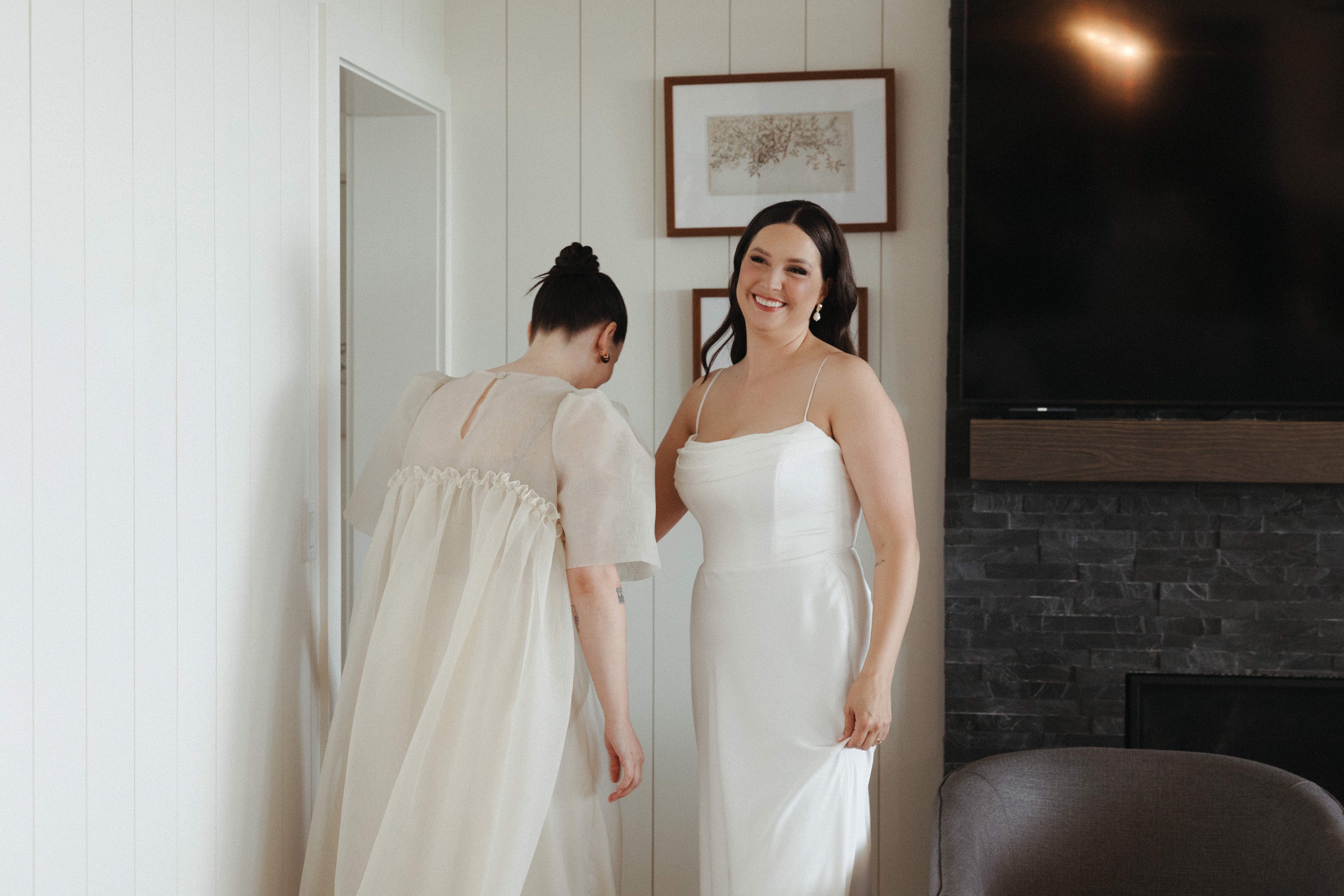 Two brides laughing together.