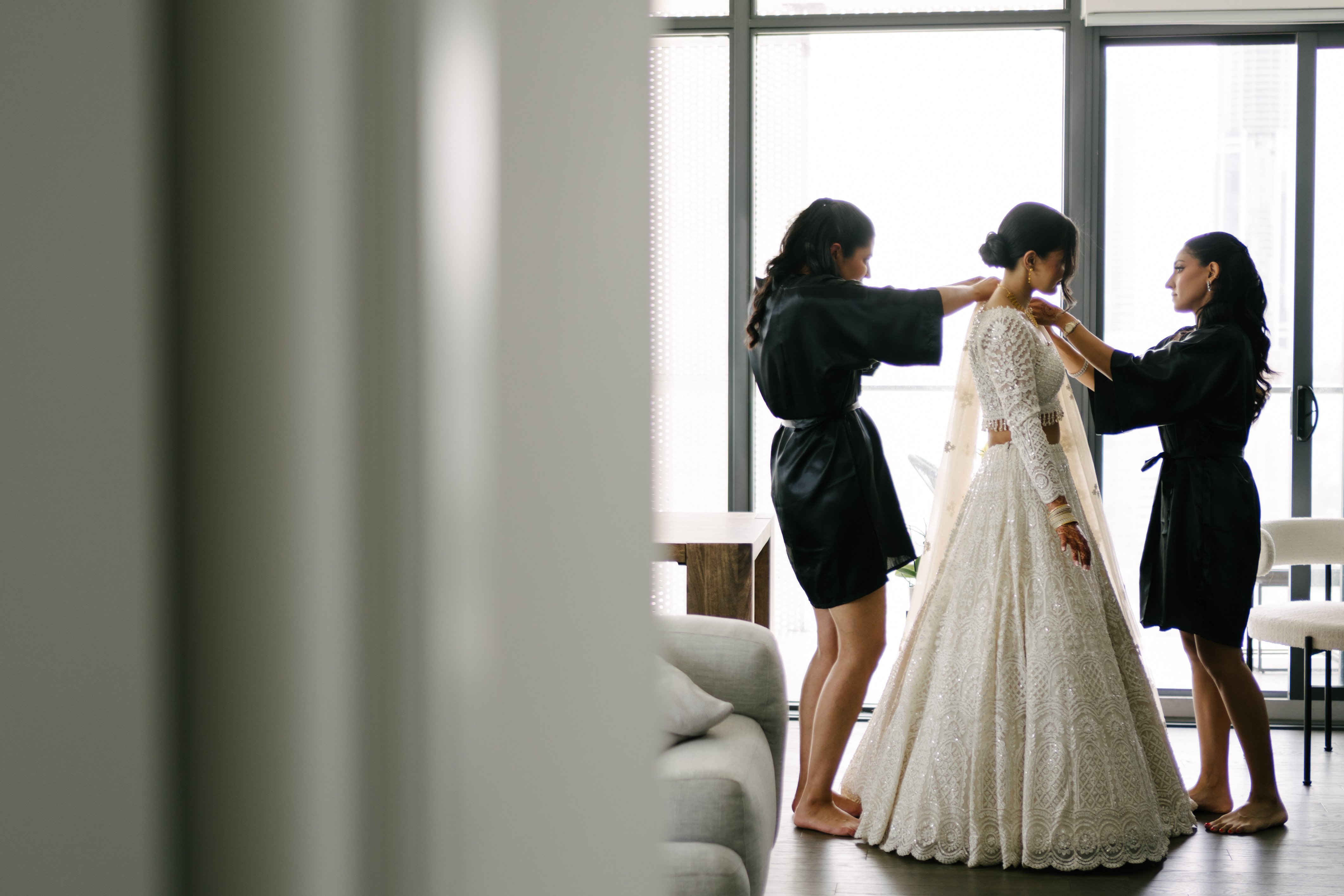 Bride getting dressed for wedding