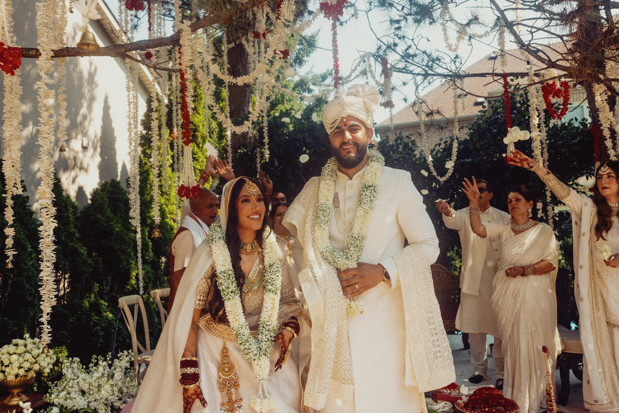 Haris and Gital pose at the outdoor mehdi celebration.