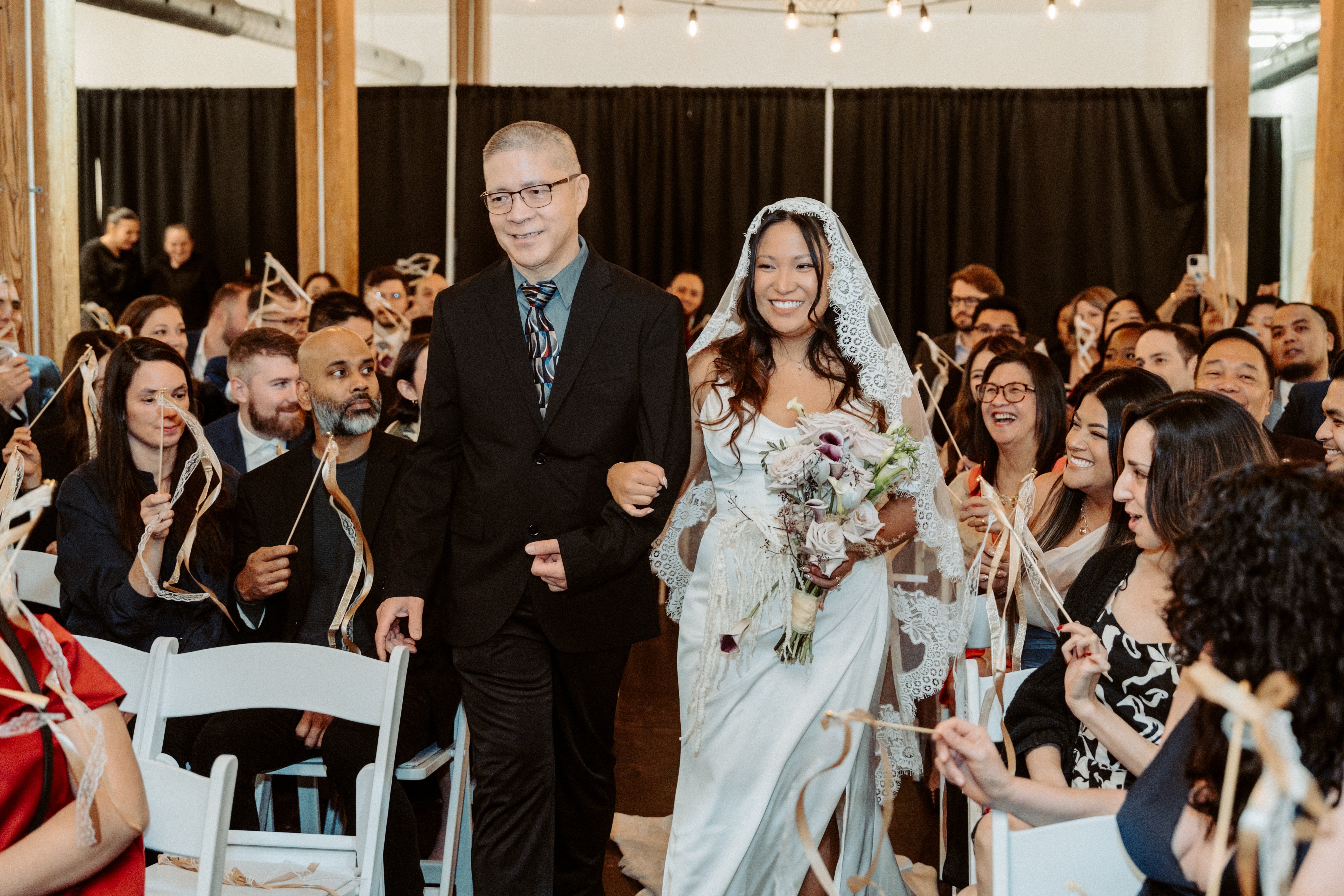 Bride walking down aisle with dad