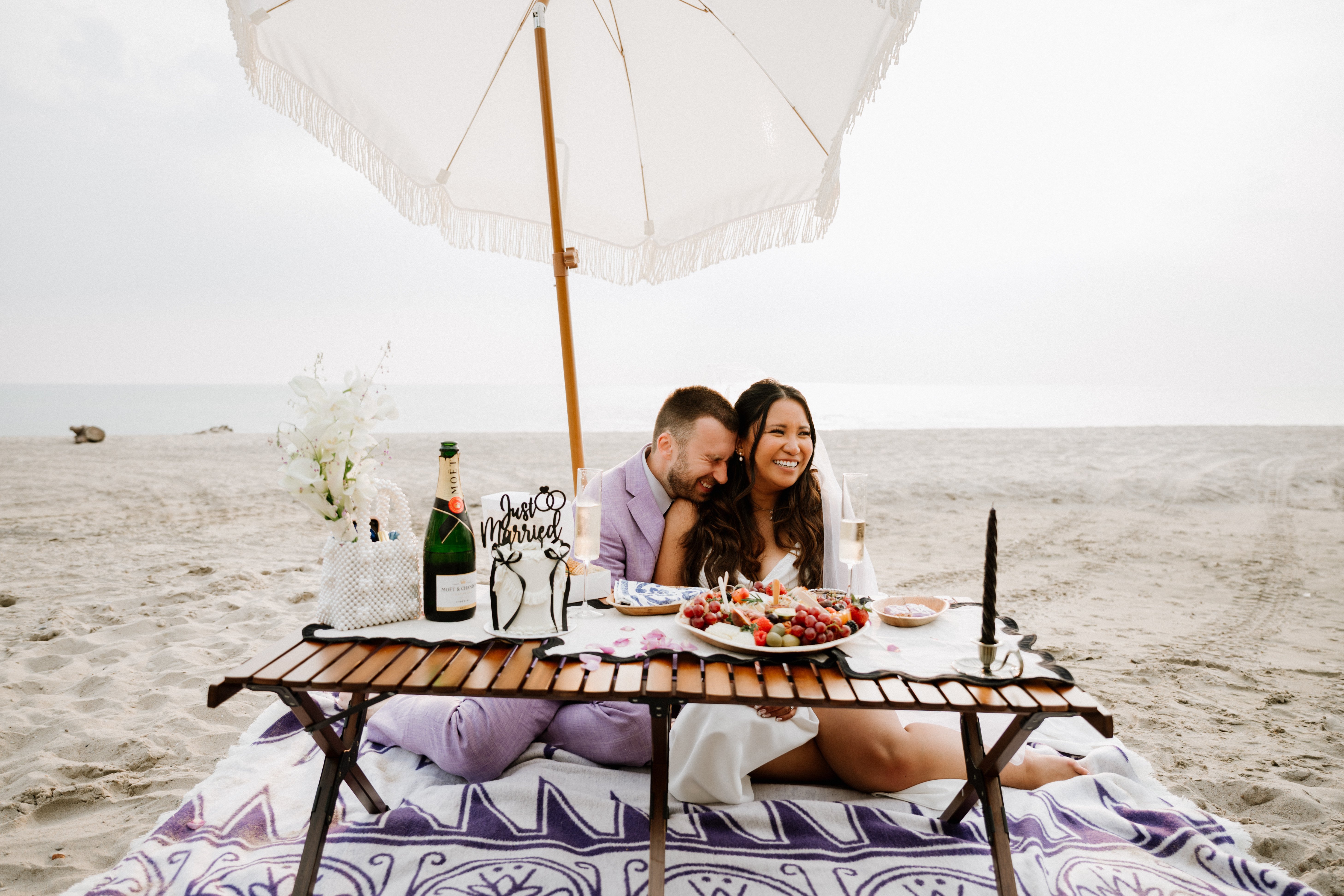 Bride and groom having a picnic