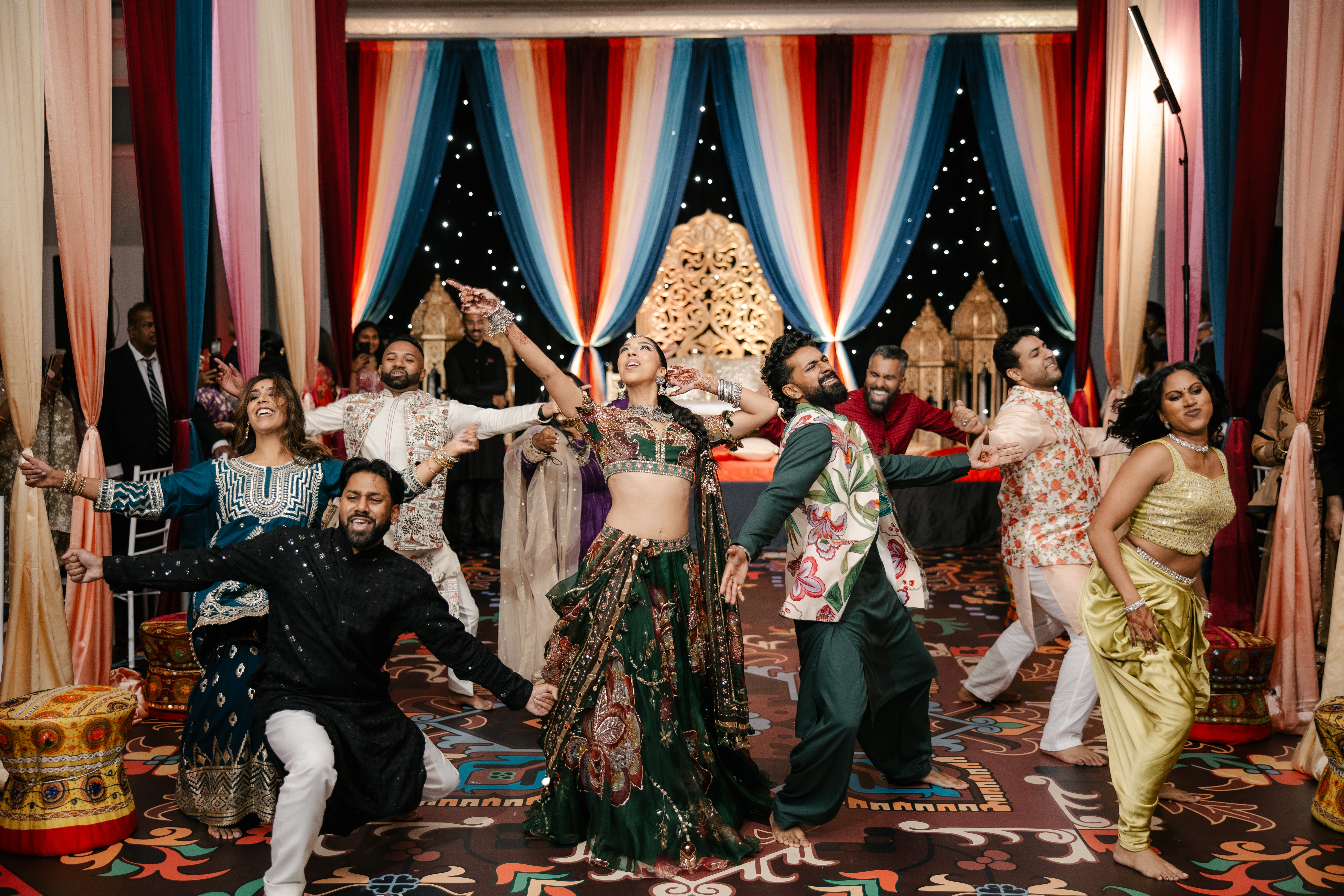 Bride and groom dancing in a group