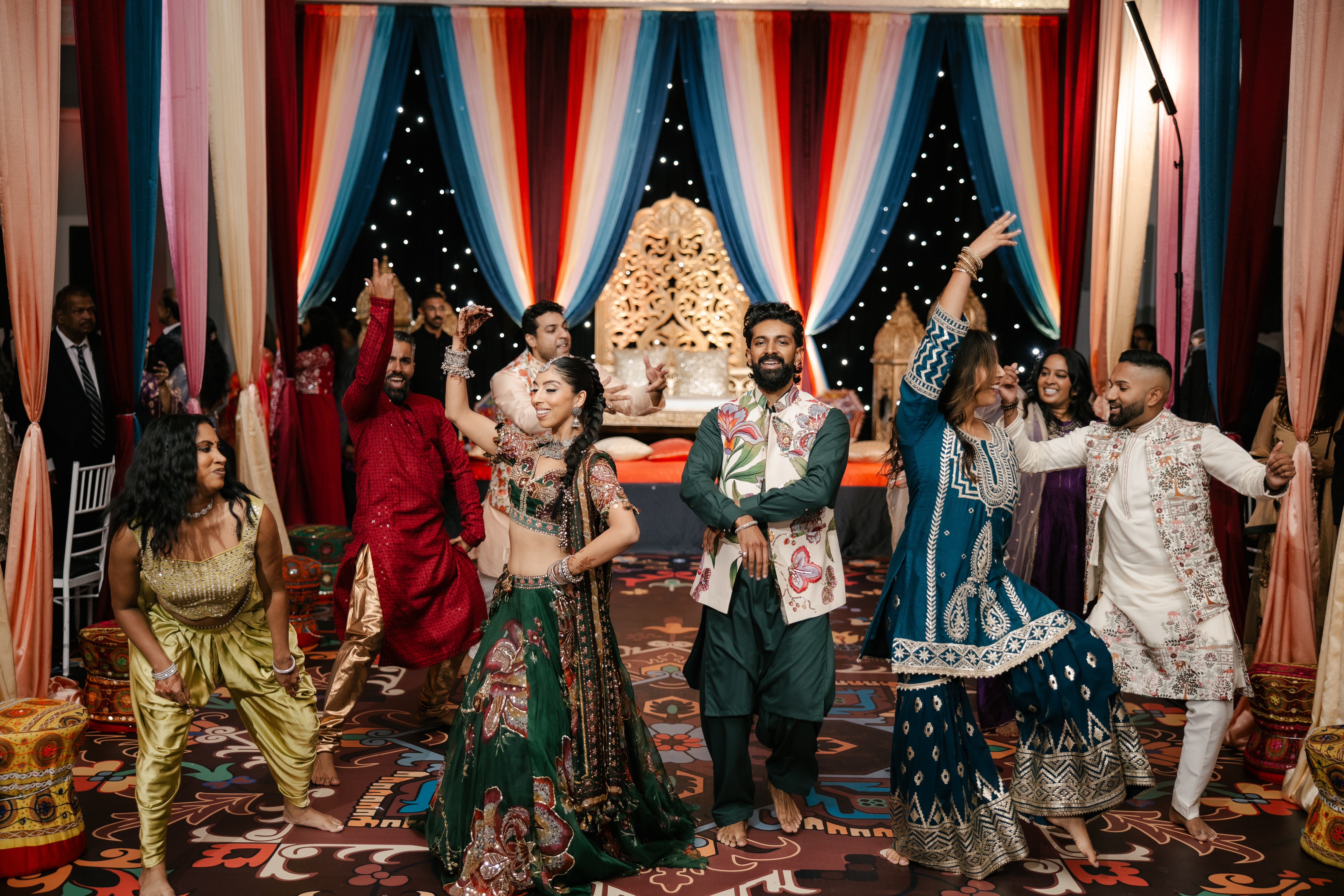 Bride and groom dancing in a group