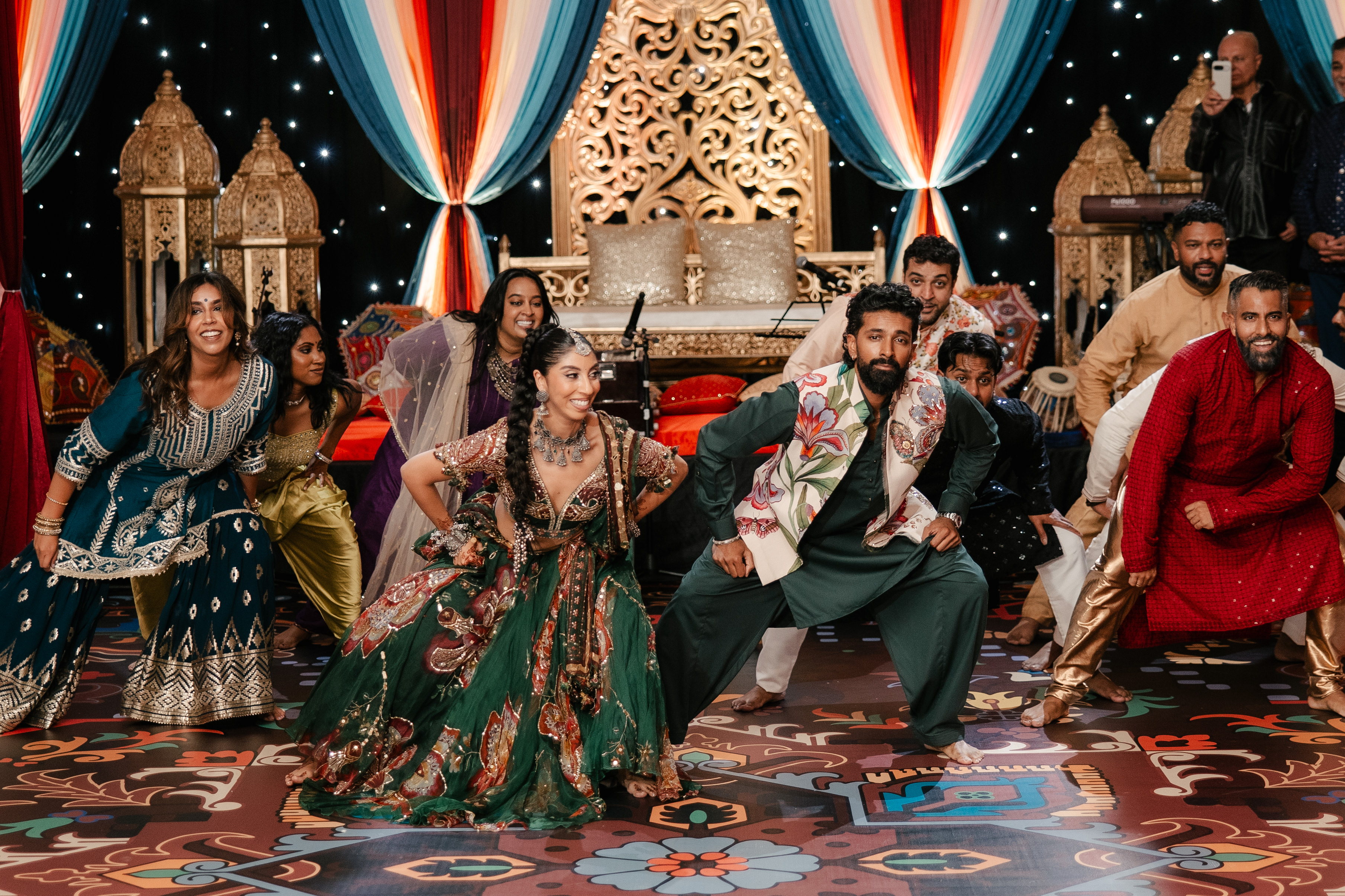 Bride and groom dancing in a group