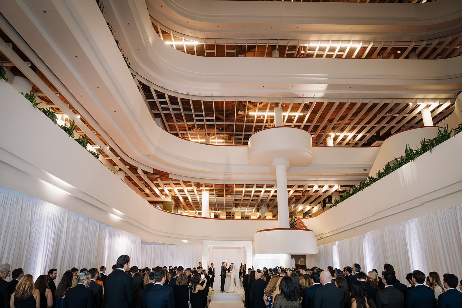 Bride and groom saying vows in Toronto Reference Library