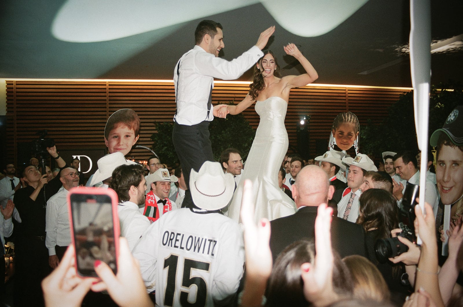 Bride and groom doing the hora